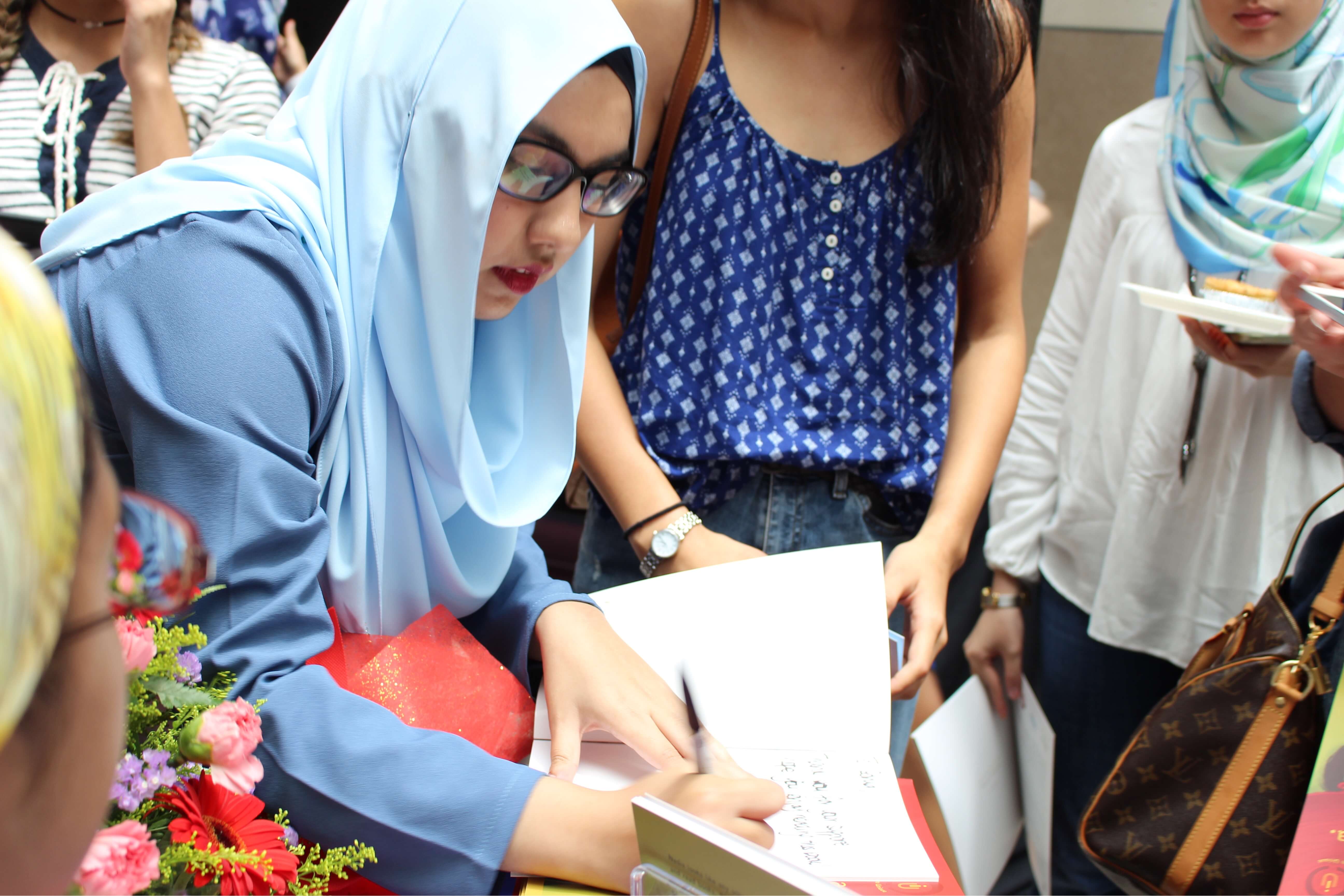 Huda Patel signing on her debut book during the book launch at Publika Shopping Mall