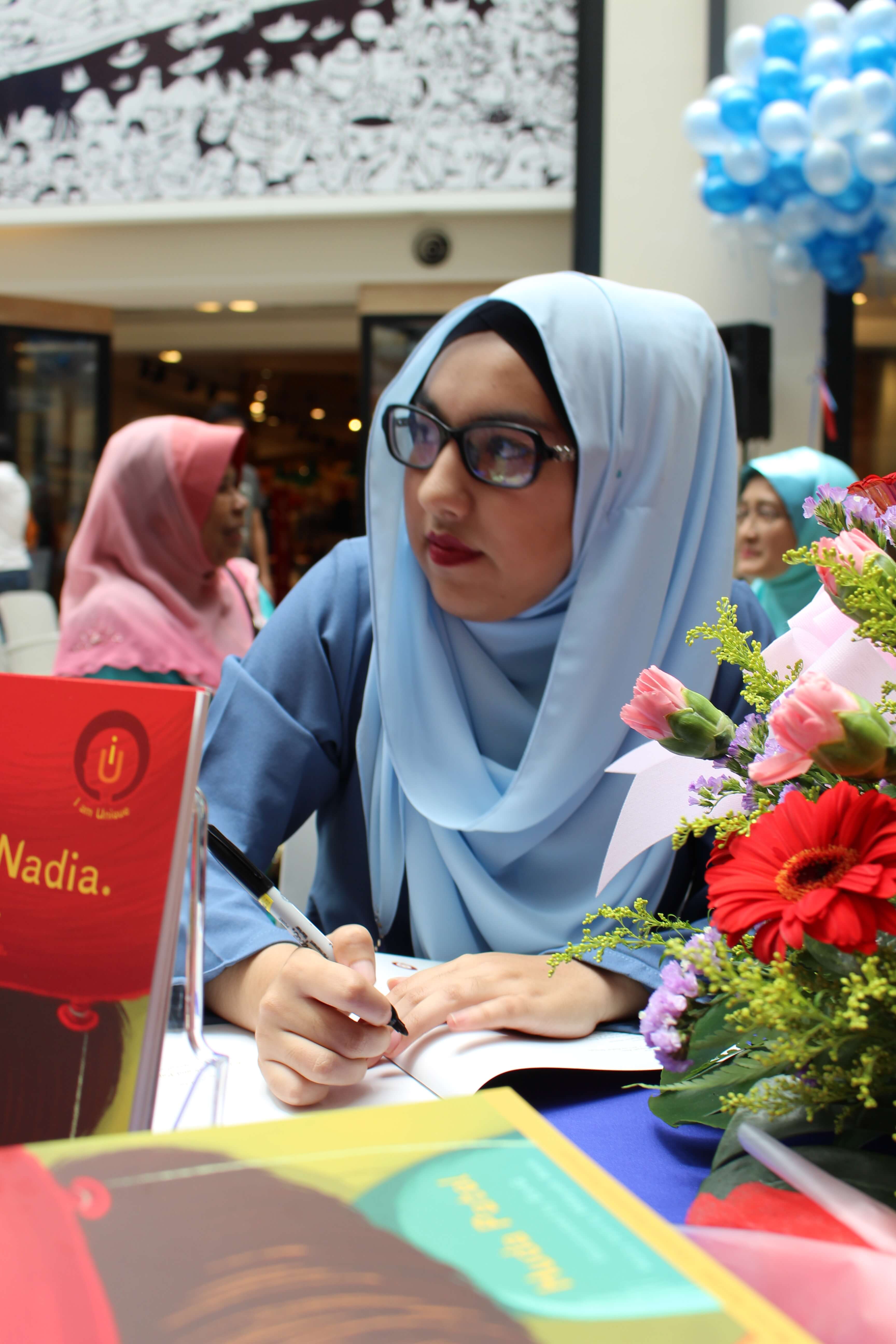 Huda Patel signing on her debut book during the book launch at Publika Shopping Mall