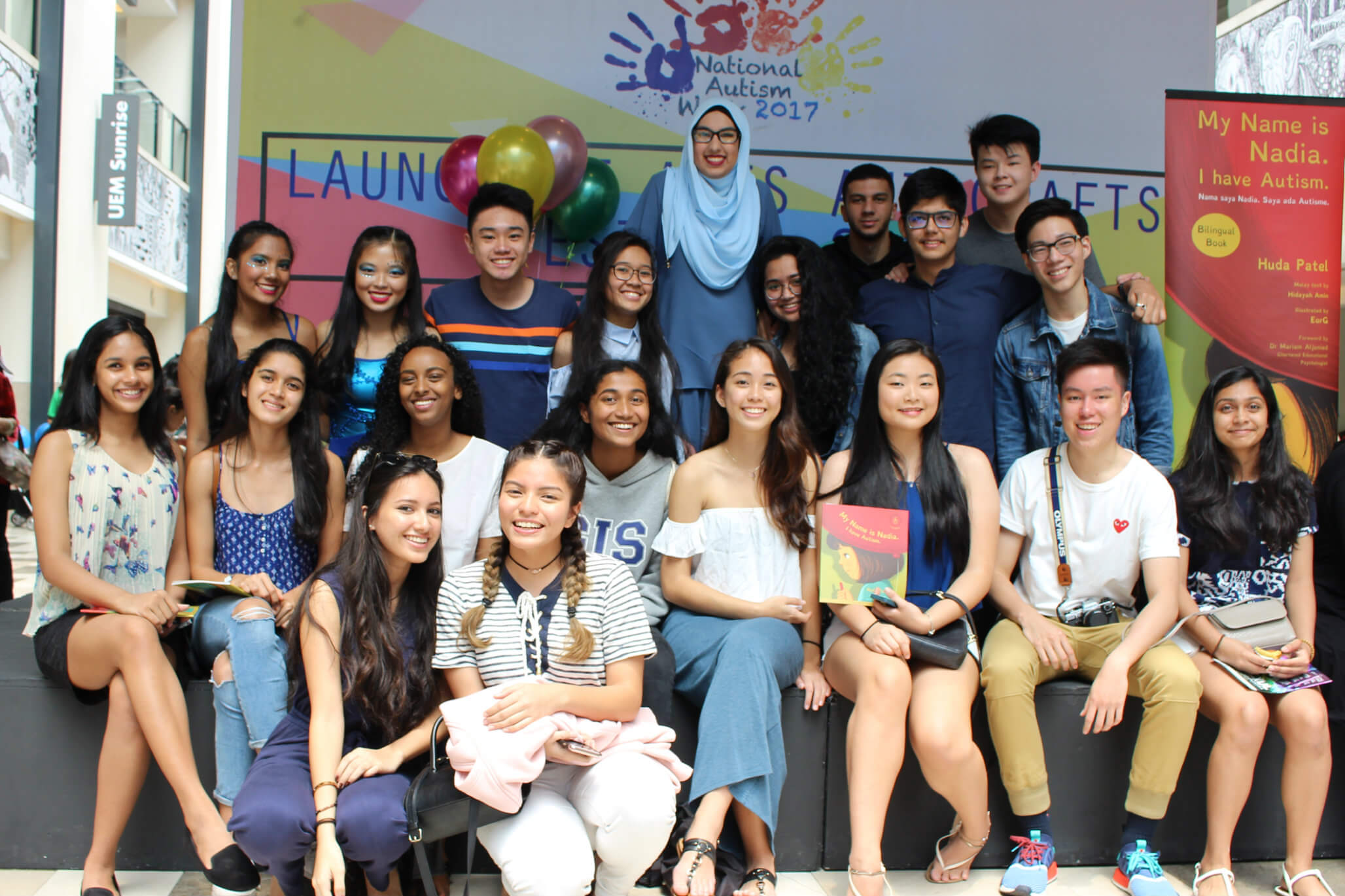 Huda posing with her GIS schoolmates who came for her book launch at Publika Shopping Mall